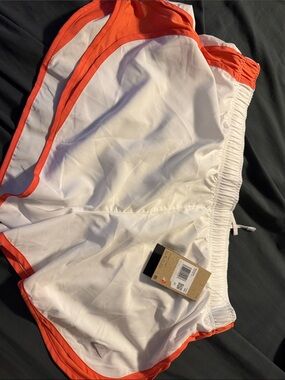 Nike White Athletic Shorts with Orange Trim